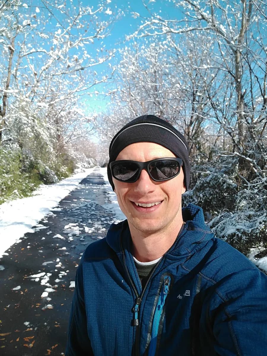 The Chief Ladiga Trail covered in snow, bare trees and blue sky, December 2017