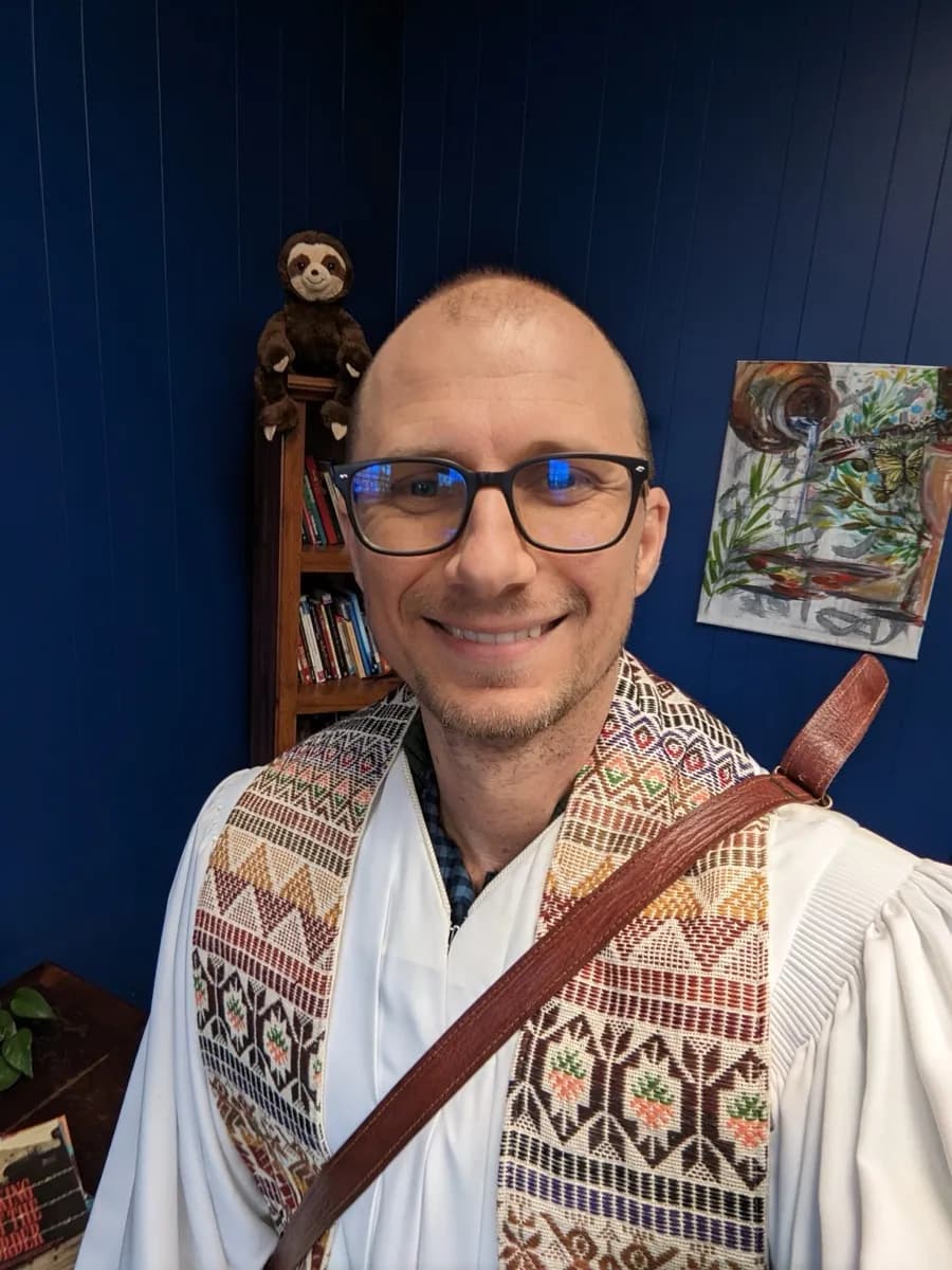 Matt Headley in clergy stole