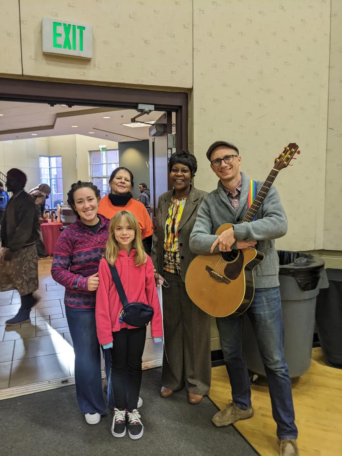 Matt Headley with guitar at Shepherd's Table breakfast, January 2025
