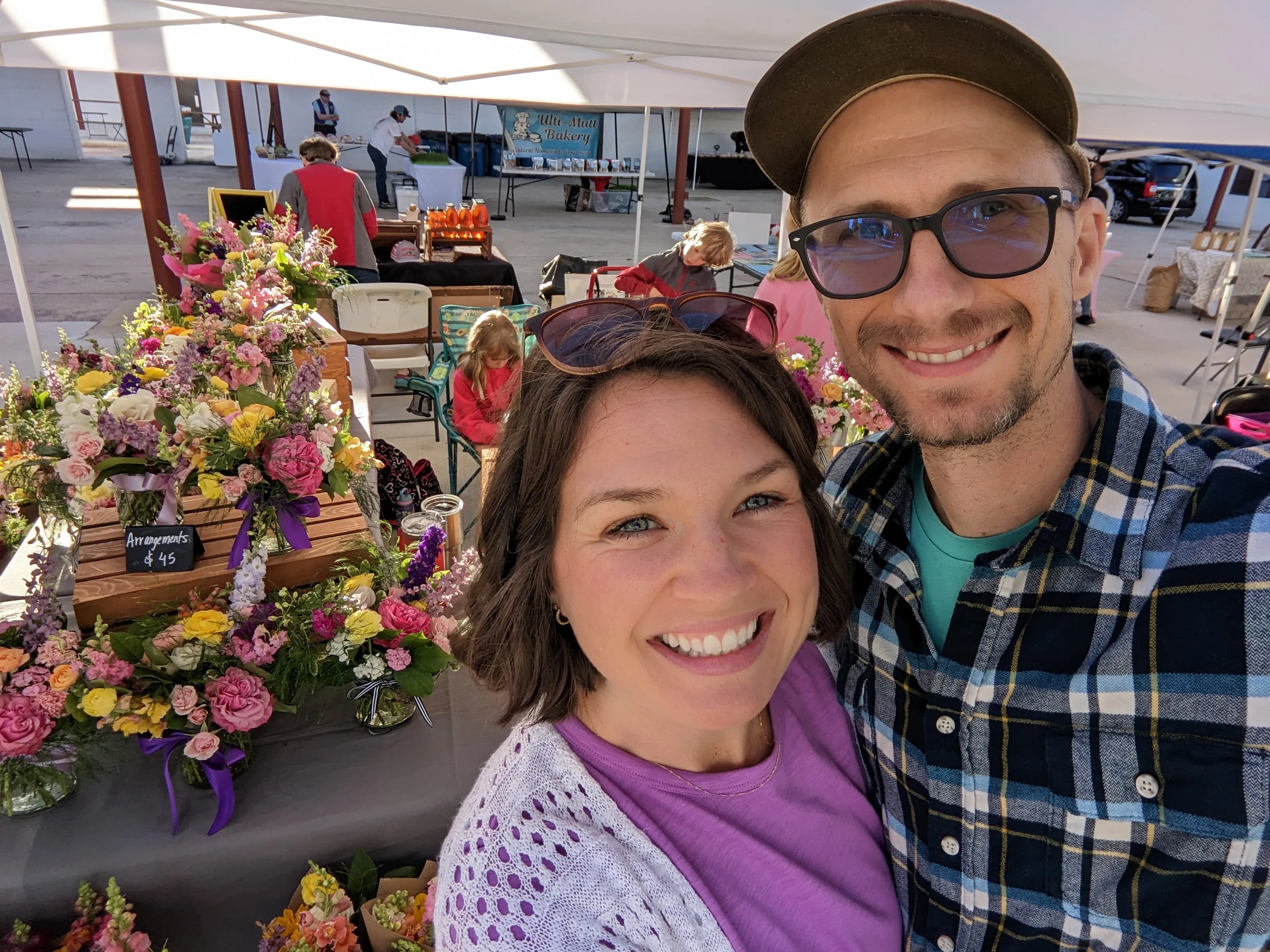 Matt and Heather Headley at the Headley Flower Farm booth at the Anniston Farmers Market, May 2024