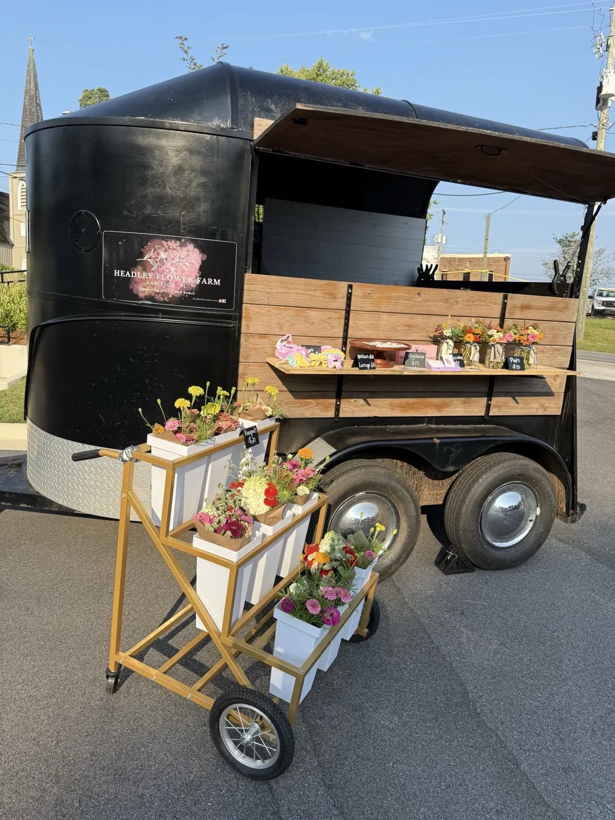 The Headley Flower Farm Bloom Bar — branded horse trailer at the farmers market